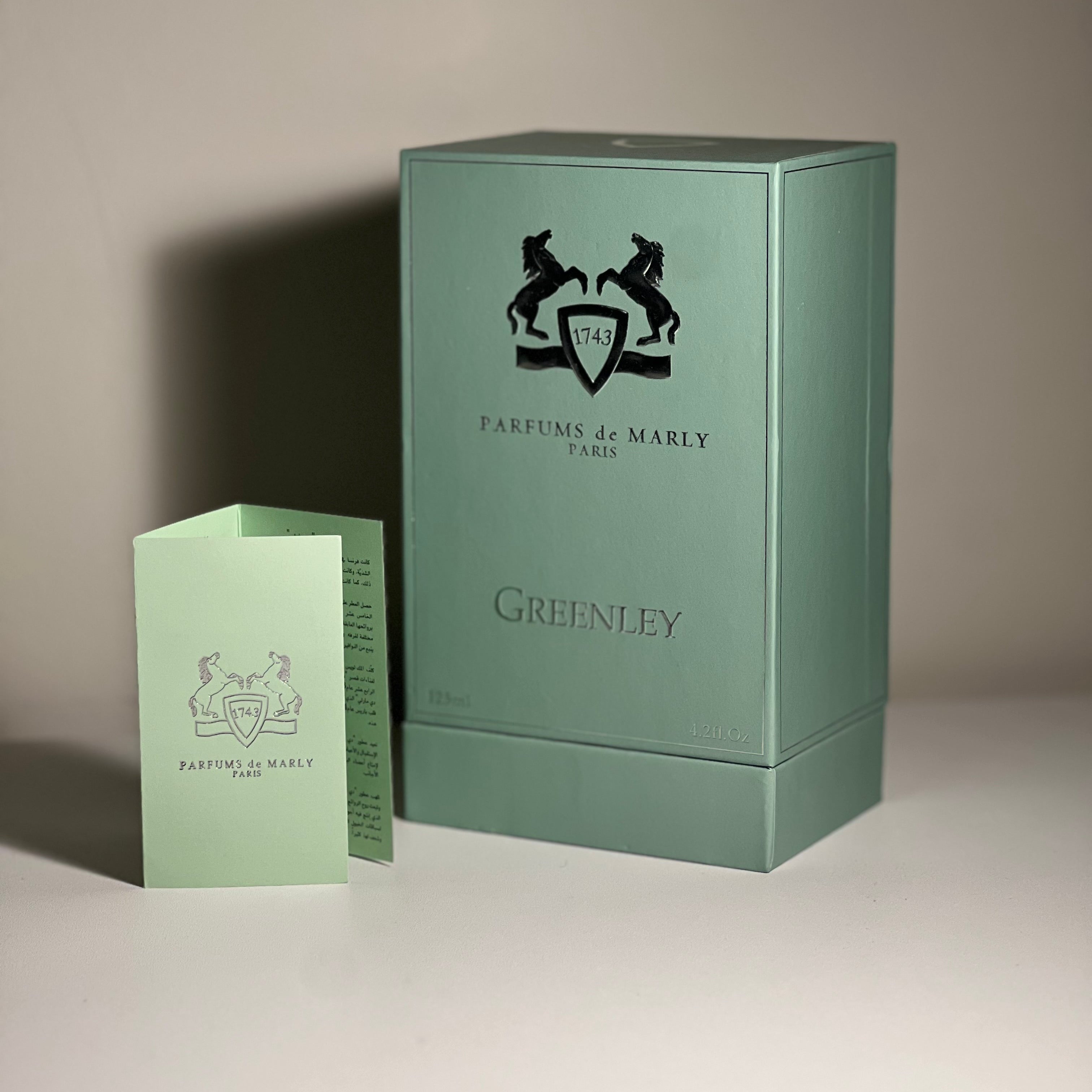 Greenley perfume box with Parfums de Marly logo on a neutral background