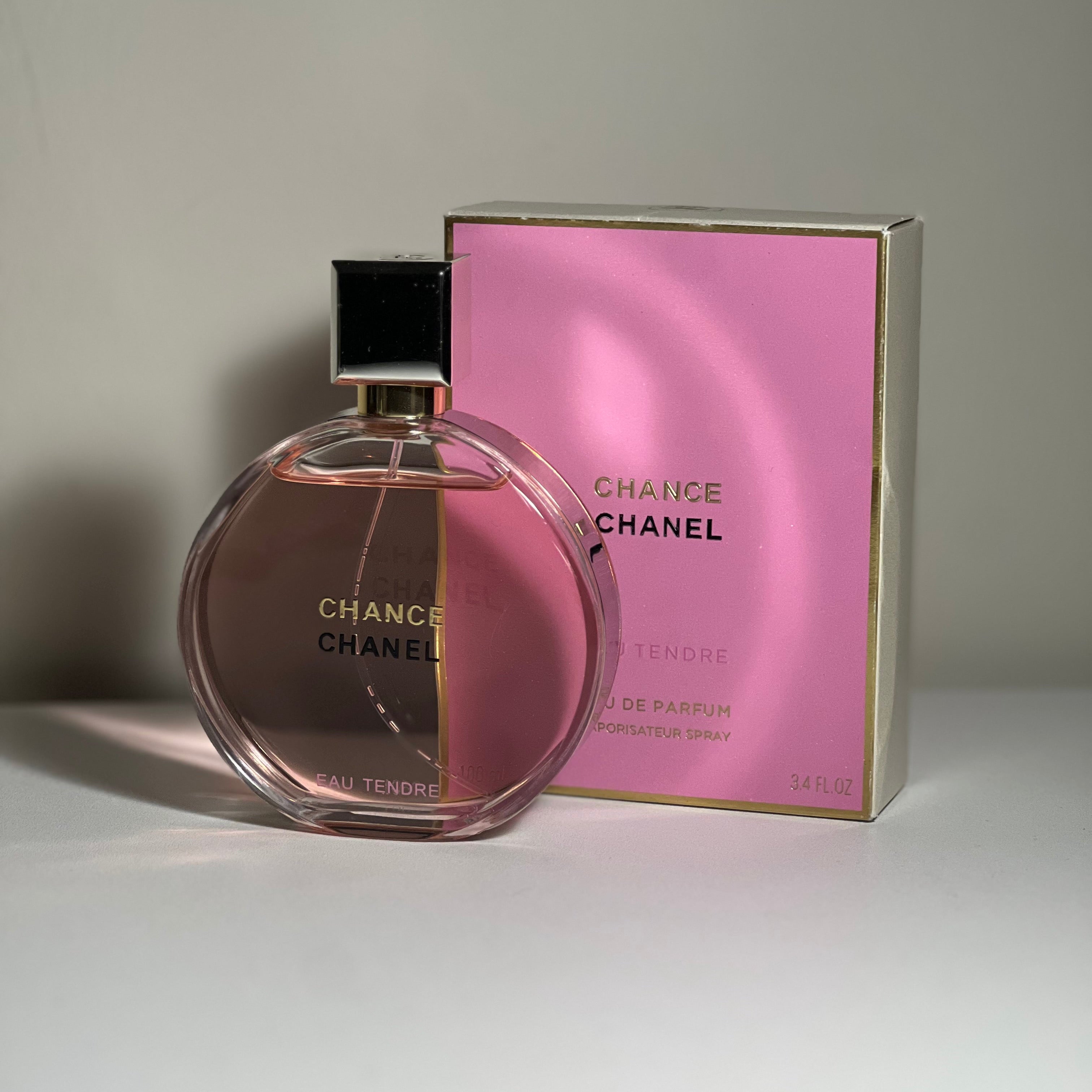 Chanel Chance perfume bottle and packaging on a neutral background
