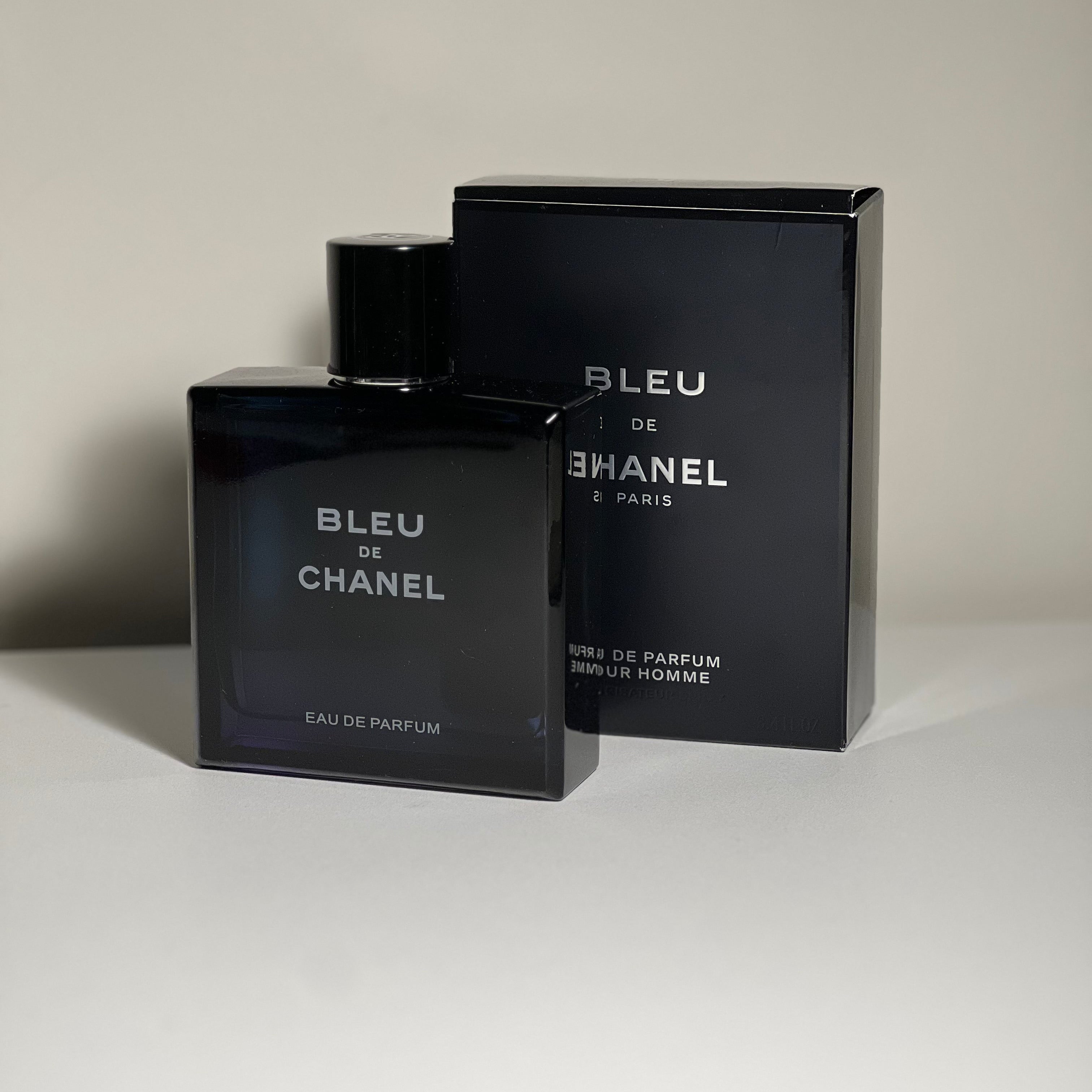 Bleu de Chanel perfume bottle and packaging on a neutral background