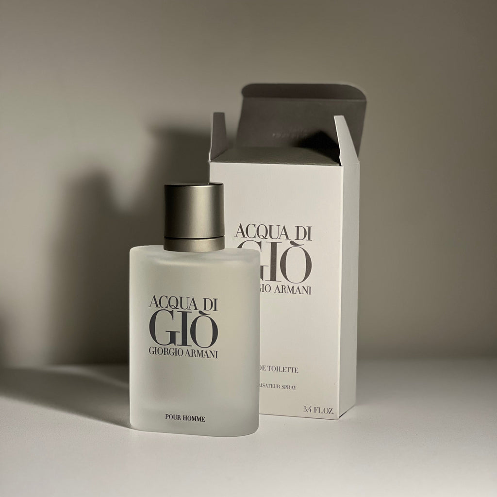 Acqua di Giò perfume bottle and packaging on a neutral background