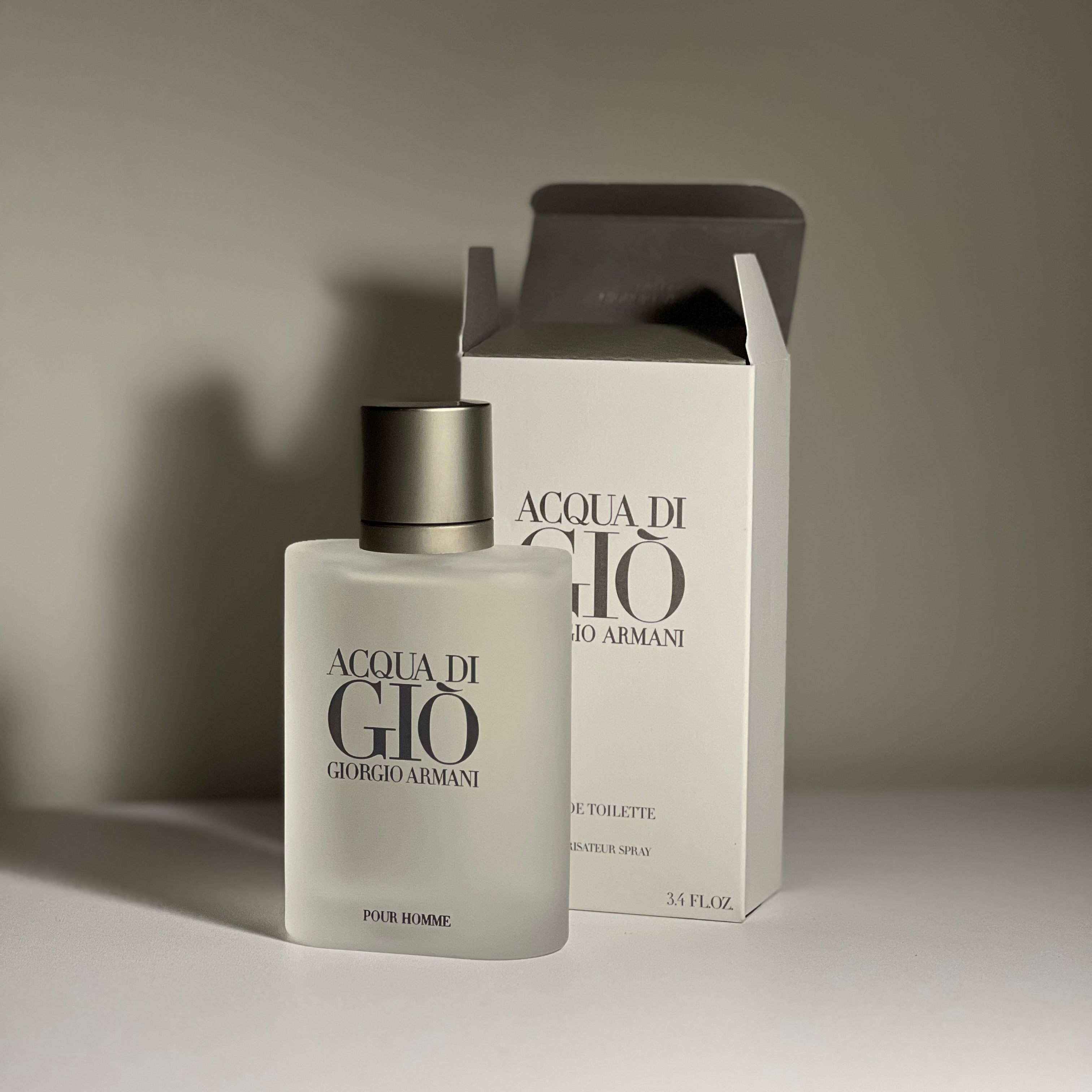 Acqua di Giò perfume bottle and packaging on a neutral background