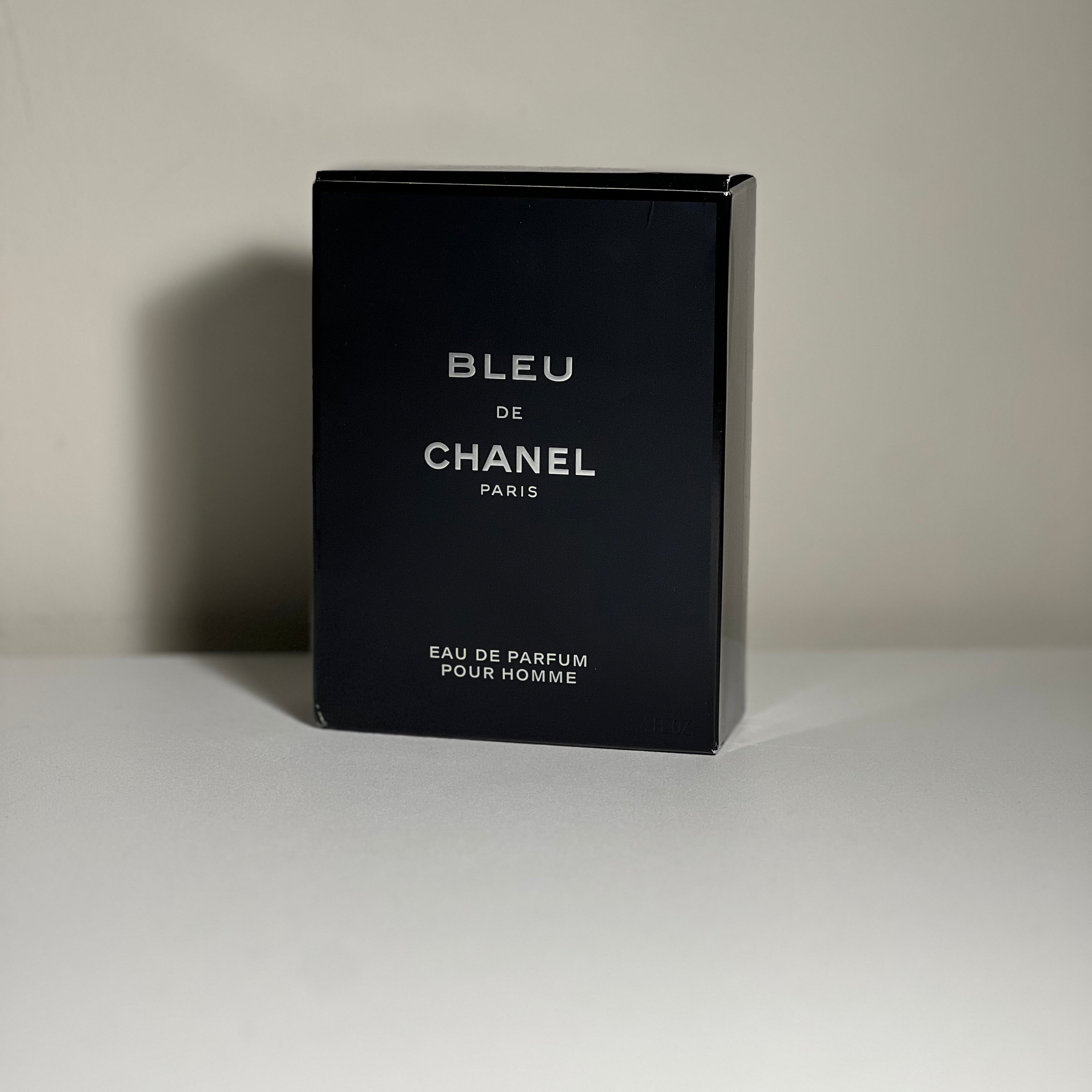 Black box of Bleu de Chanel Eau de Parfum for men on a neutral background
